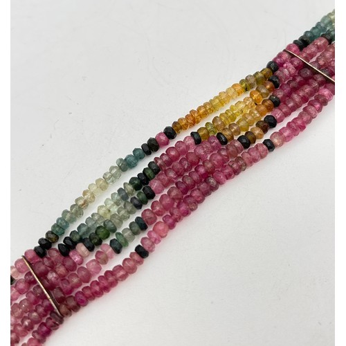1059 - A 5 strand faceted multi coloured tourmaline bead bracelet with large square push clasp & safety cli... 