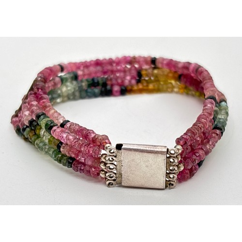 1059 - A 5 strand faceted multi coloured tourmaline bead bracelet with large square push clasp & safety cli... 