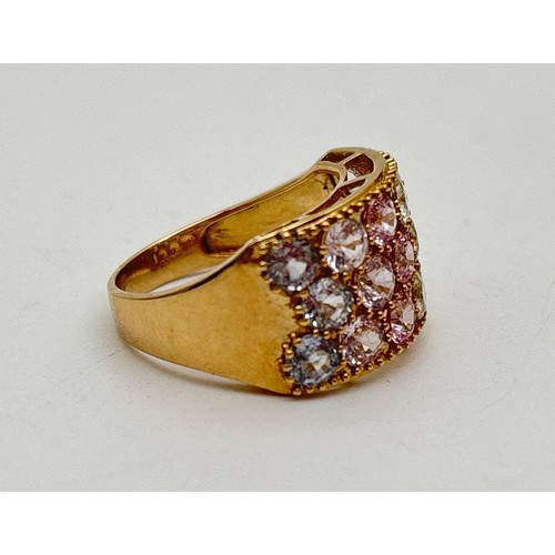 1001 - A 9ct gold wide band half eternity style ring set with a pastel rainbow spectrum of round cut spinel... 