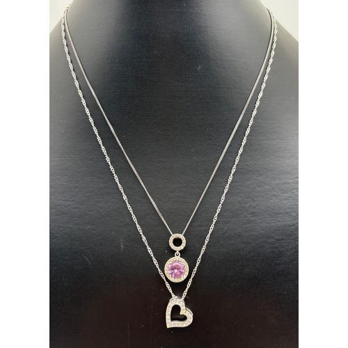1008 - 2 modern silver stone set pendant necklaces. A double circular drop pendant set with central round c... 