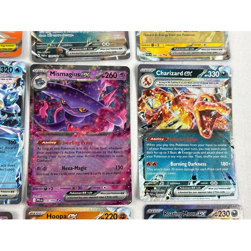 57 - 16 Pokémon EX trading cards, to include Charizard from Paldean Fates and Mismagius from Phantasmal F... 
