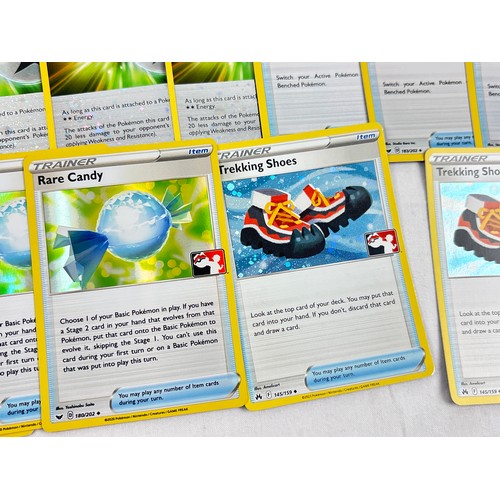 59 - Approx. 52 Holo and reverse holo Pokémon trainer and energy trading cards, all from the Sword & Shie... 