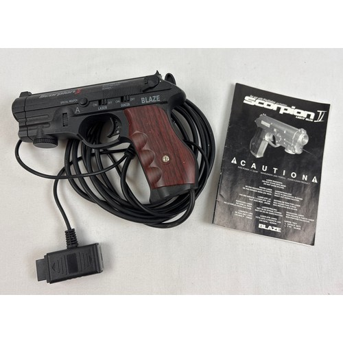 25 - Blaze Scorpion II light gun controller in black, with fake wood grip, for use with Playstation 1. Co... 