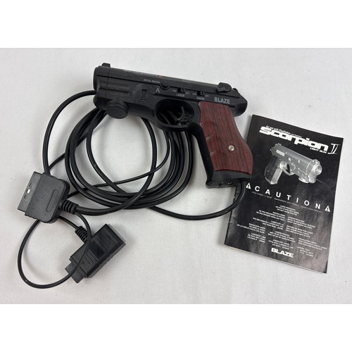 25 - Blaze Scorpion II light gun controller in black, with fake wood grip, for use with Playstation 1. Co... 