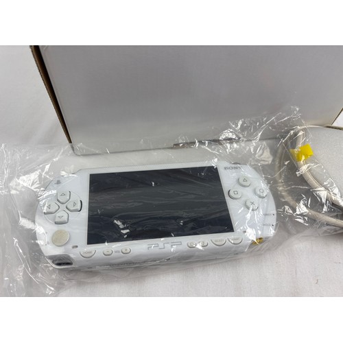 10 - A boxed original classic Sony PSP Playstation Portable 1000, region free hand held gaming console, i... 