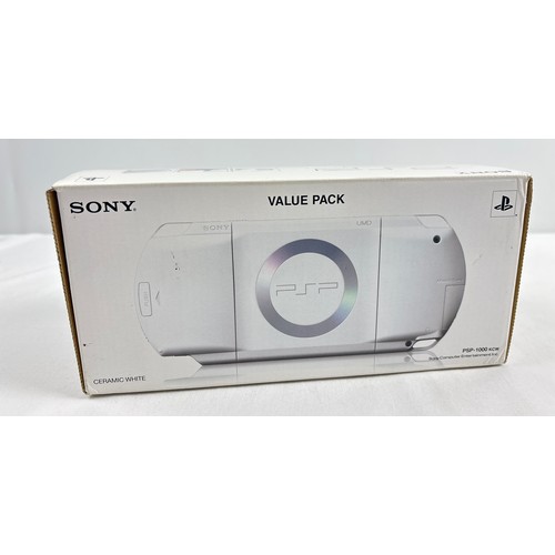 10 - A boxed original classic Sony PSP Playstation Portable 1000, region free hand held gaming console, i... 