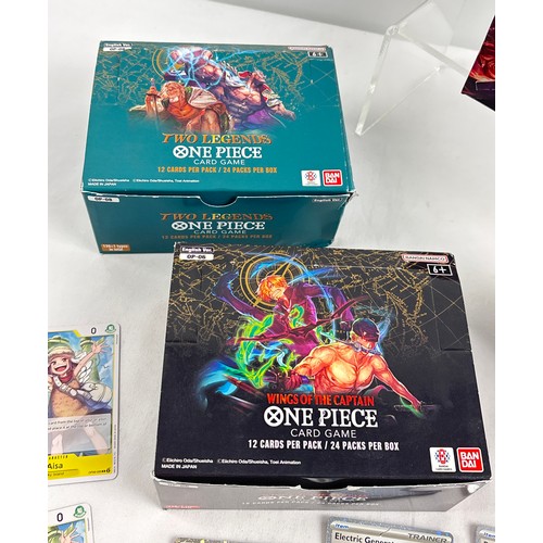 61 - A collection of trading card items. 2 x empty One Piece boxes together with an empty League of Legen... 