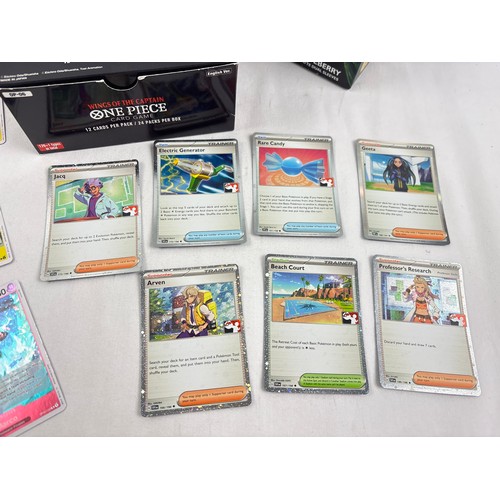 61 - A collection of trading card items. 2 x empty One Piece boxes together with an empty League of Legen... 