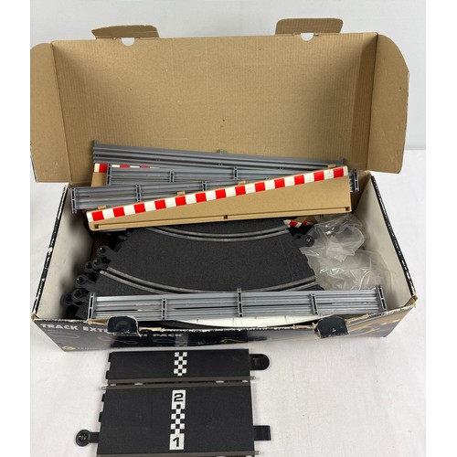 68 - A boxed Scalextric track extension pack C (C8036) together with an electronic lap counter (C8215), i... 