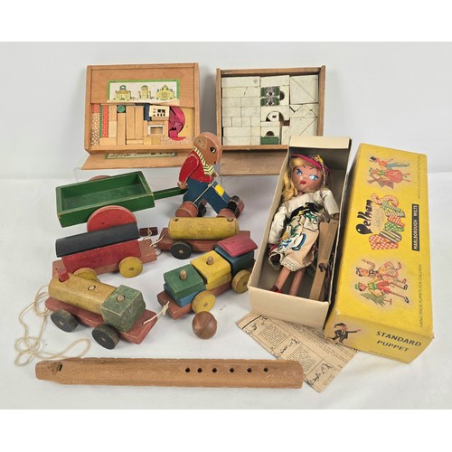 165 - A collection of vintage wooden toys together with a boxed 1950's Mitzi Pelham puppet. Wooden toys in... 