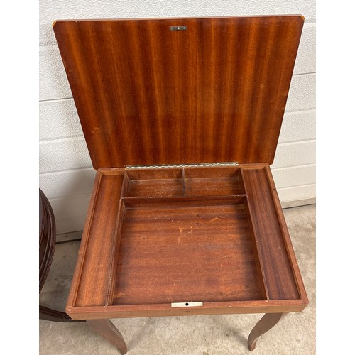 A vintage reproduction drum table on pedestal base with red leather ...