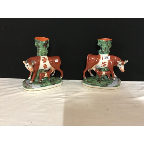 248 - PAIR OF STAFFORDSHIRE COW SPILL HOLDERS