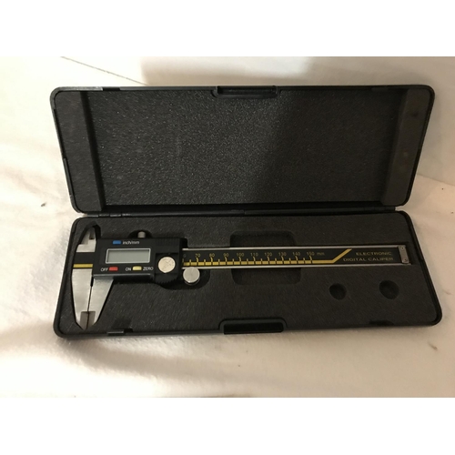 255 - BOXED DIGITAL CALIPER AND A SMALL QTY OF ROYAL NAVY RELATED BOOKLETS