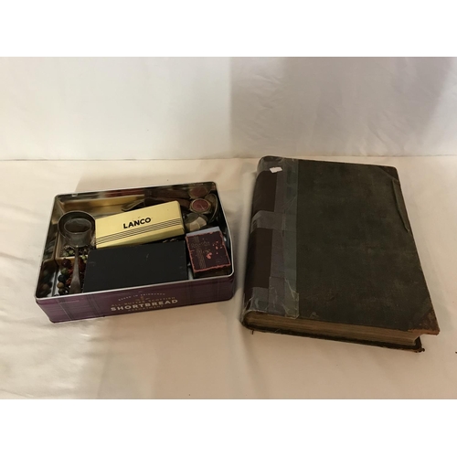 265 - TIN OF COLLECTABLES TO INCLUDE A RONSON CIGARETTE LIGHTER, CUTLERY, ANTIQUE BOOK ETC
