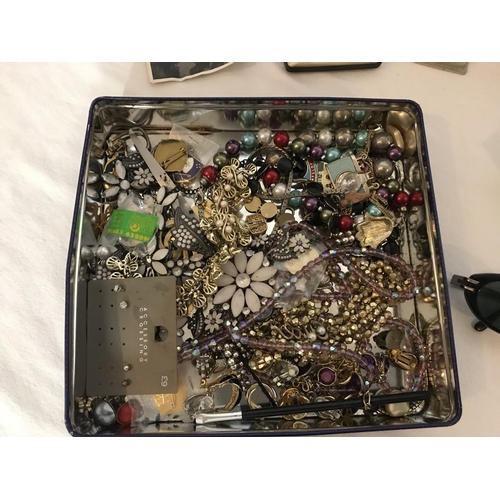 267 - TIN OF COSTUME JEWELLERY AND COLLECTABLES