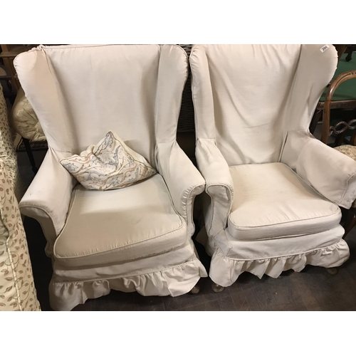 290 - PAIR OF WINGBACK FIRESIDE CHAIRS WITH LOOSE COVERS