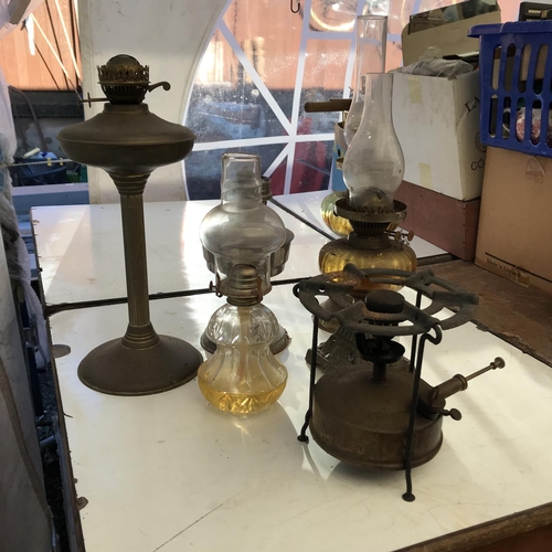 56 - 5 OIL LAMPS AND A PRIMUS STOVE