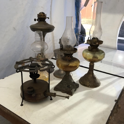 56 - 5 OIL LAMPS AND A PRIMUS STOVE