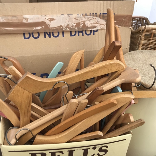 67 - 2 BOXES OF COAT HANGERS WICKER BASKETS, TRUG AND CASES ETC