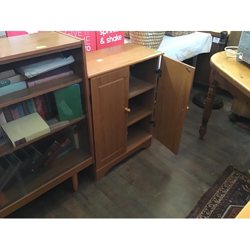 322 - TEAK EFFECT BOOKCASE C/W BOOKS AND MODERN 2 DOOR CABINET