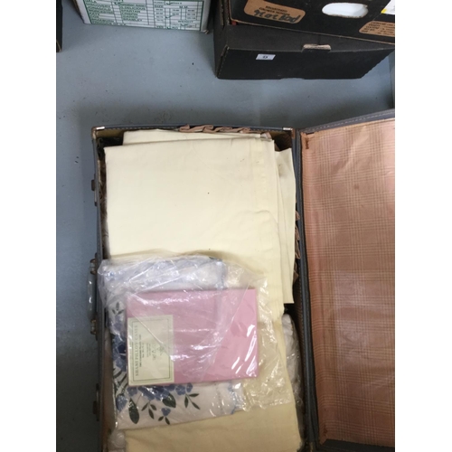 77 - 5 BOXES OF LINEN AND A SUITCASE OF LINEN