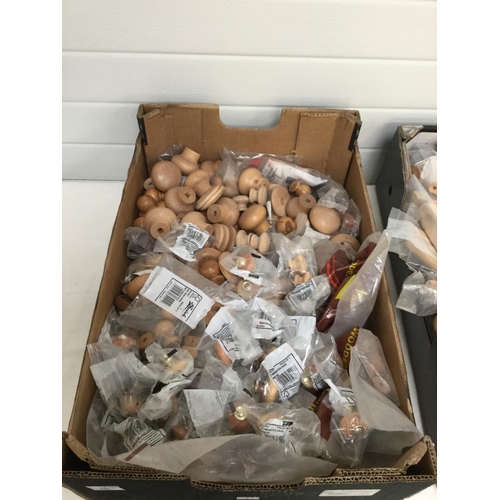 169 - 2 BOXES OF WOODEN DOOR KNOBS ETC