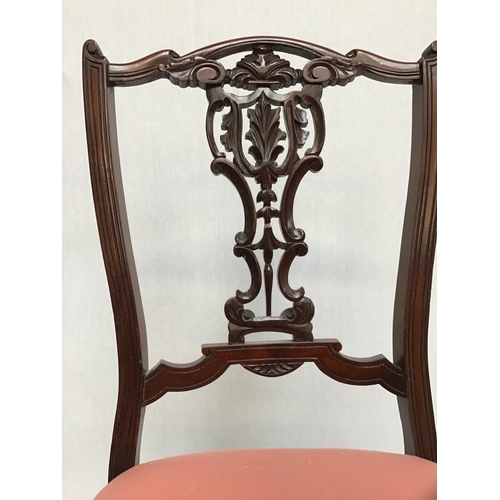 212 - VICTORIAN CARVED NURSING CHAIR ON BRASS AND CERAMIC CASTORS