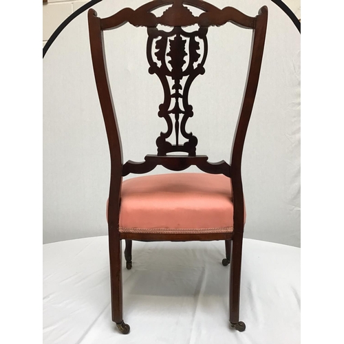 212 - VICTORIAN CARVED NURSING CHAIR ON BRASS AND CERAMIC CASTORS