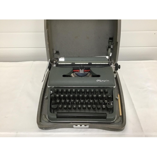 232 - VINTAGE OLYMPIA TYPEWRITER IN CASE