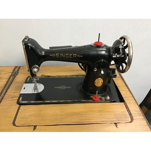 233 - SINGER ELECTRIC SEWING MACHINE IN CABINET