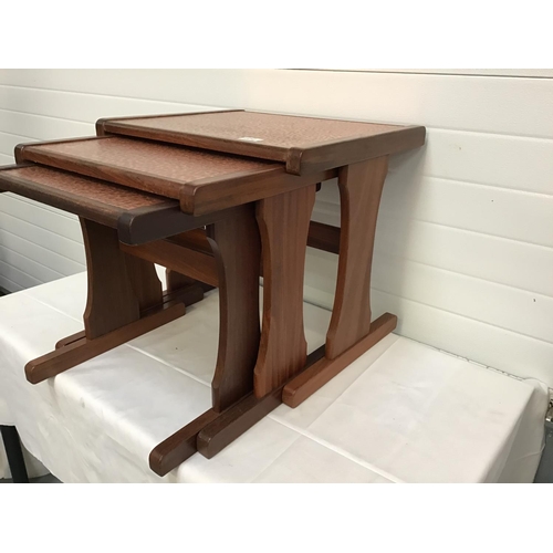 234 - VINTAGE G PLAN TEAK NEST OF 3 TABLES WITH COPPER INSET TOPS