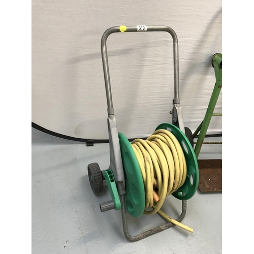 310 - GARDEN HOSE ON REEL AND SACK TRUCK