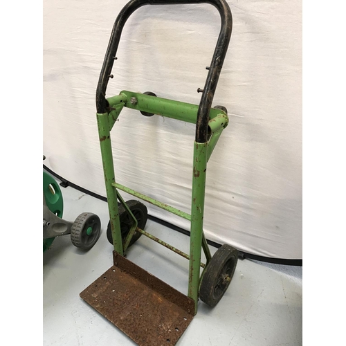 310 - GARDEN HOSE ON REEL AND SACK TRUCK