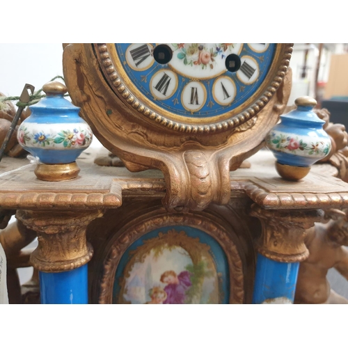 127 - VICTORIAN FRENCH GILT MANTEL CLOCK WITH HAND PAINTED PORCELAIN PANELS & SUPPORTS A/F