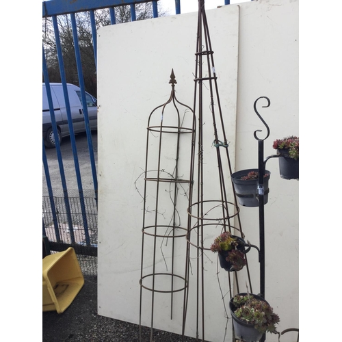 96 - 3 METAL GARDEN OBILISKS AND A METAL PLANT STAND