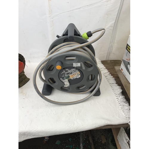 131 - FLYMO RECHARABLE STRIMMER W/O AND HOSE ON REEL