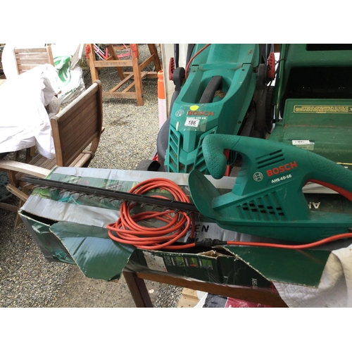 186 - BOSCH ELECTRIC ROTARY MOWER, A BOSCH ELECTRIC HEDGE CUTTER AND A QUALCAST ELECTRIC MOWER W/O