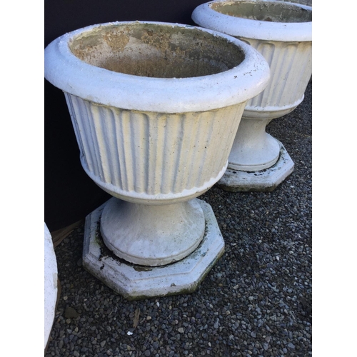 235 - PAIR OF GARDEN URNS ON PLINTHS
H 24