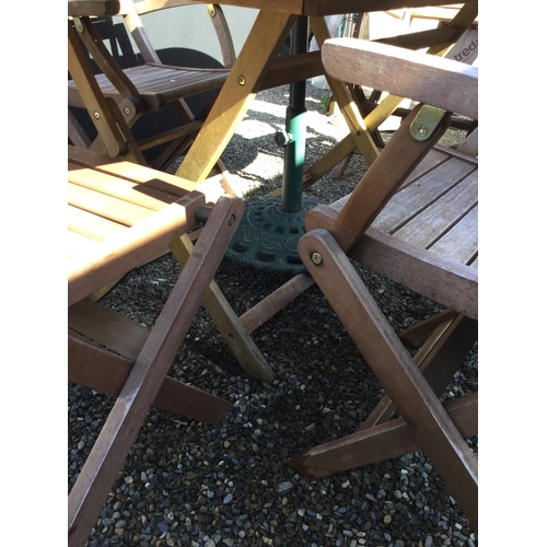 241 - GARDEN TABLE AND 6 CHAIRS AND GARDEN BROLLY WITH CAST IRON BASE
63 X 34