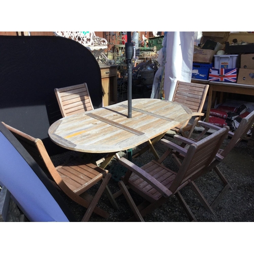 241 - GARDEN TABLE AND 6 CHAIRS AND GARDEN BROLLY WITH CAST IRON BASE
63 X 34