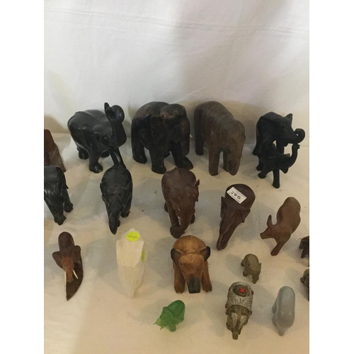 285 - 3 SHELVES OF ASSORTED ELEPHENT ORNAMENTS TO INCLUDE CARVED WOOD EXAMPLES