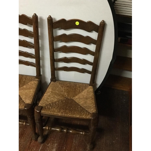 444 - 4 OAK STRETCHERED LADDER BACK DINING CHAIRS