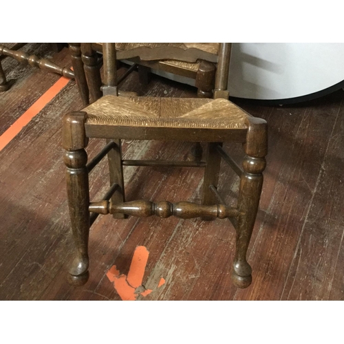 444 - 4 OAK STRETCHERED LADDER BACK DINING CHAIRS