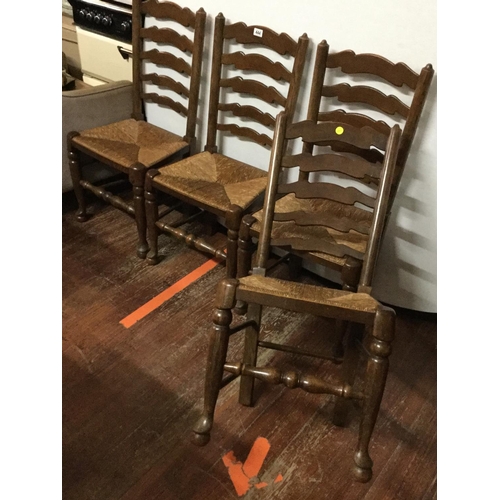 444 - 4 OAK STRETCHERED LADDER BACK DINING CHAIRS