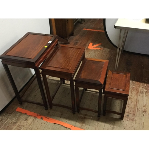 447 - CHINESE STYLE NEST OF 4 MAHOGANY TABLES