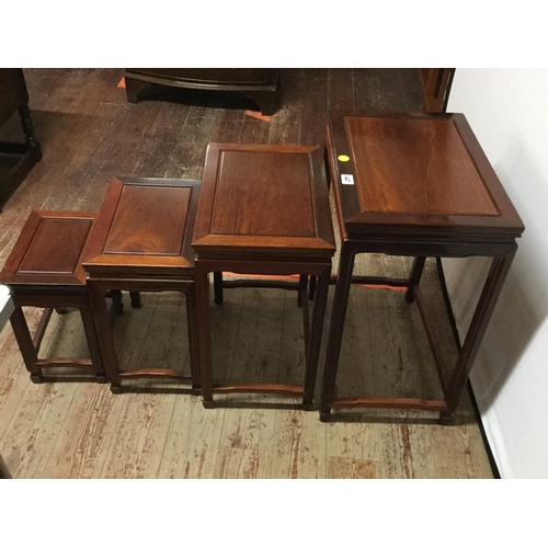 447 - CHINESE STYLE NEST OF 4 MAHOGANY TABLES