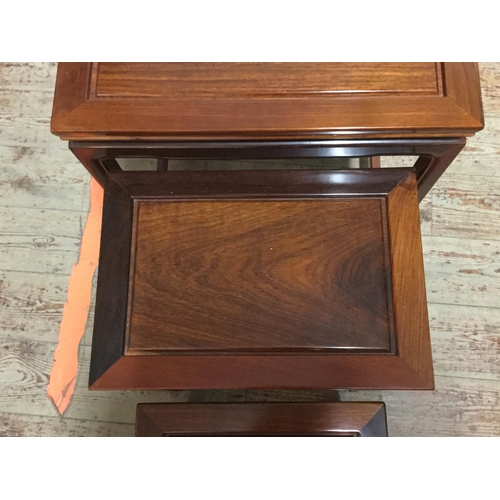 447 - CHINESE STYLE NEST OF 4 MAHOGANY TABLES