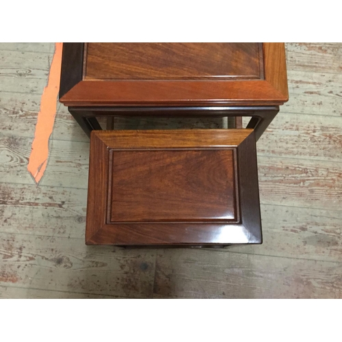 447 - CHINESE STYLE NEST OF 4 MAHOGANY TABLES