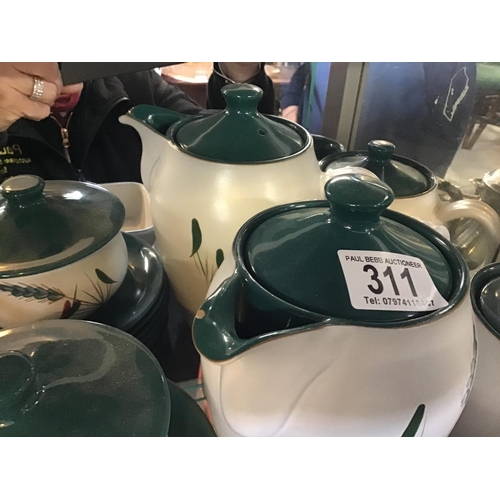 311 - 5 SHELVES OF DENBY GREEN WHEAT CHINA TO INCLUDE TEA POTS, VEGETABLE DISHES, JUGS ETC