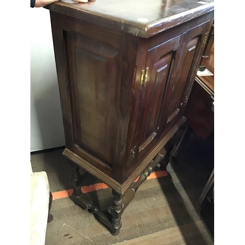 482 - REPRODUCTION STRETCHERED OAK 2 DOOR CABINET 
L 26